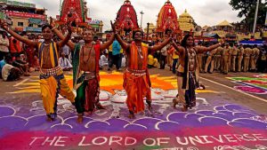 Odissi dancers performing in front of the three chariots of the deities of Jagannath,his elder brother Balabhadra and younger sister Subhadra