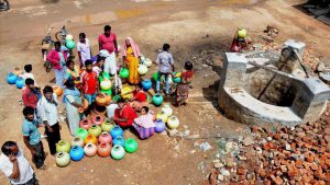 People gather around a well in a drought-hit in Lakya near Chikmagalur, Karnataka.