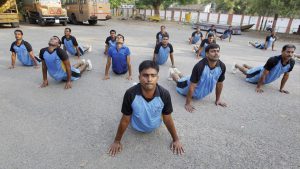 Provincial Armed Constabulary javans perform yoga on the banks of Yamuna river in Allahabad, Uttar Pradesh on June 14, 2017.