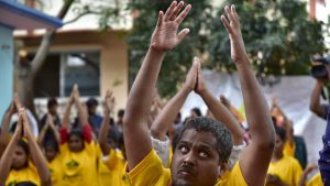 Visually challenged people perform yoga at a camp on the eve of International Yoga Day in Bengaluru, Karnataka on June 20, 2017.