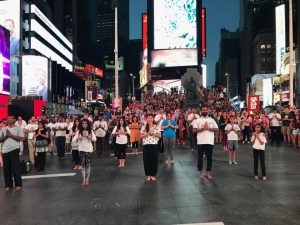 Yoga enthusiasts perform as part of a flash mob at Times Square, New York, US.