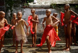 Young Hindu priests gather after taking a holy bath together during the sacred thread festival at the Pashupatinath temple in Kathmandu, Nepal