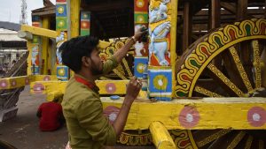 An artist paints a part of the chariot ahead of the Rath Yatra. While new chariots are made every year, the wooden horses and charioteers for each rath and the smaller deities that adorn the chariots, are made once in approximately 12 years, when the wooden idols of Jagannath and his siblings that are worshipped in the temple are replaced. That ritual – referred to as Navakalebara or new-body ceremony – was last celebrated in 2015.