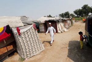 A boy from the Rohingya community arrives to pray at a mosque in a camp in New Delhi, October 4, 2018