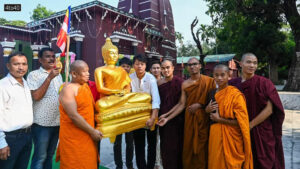 Monks and devotees carry an idol of Lord Buddha on the occasion of the Buddha Purnima festival in Tripura's Agartala.