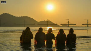 Devotees worship the setting sun at Brahmaputra Ghat in Guwahati