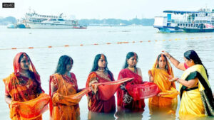 Vermilion being applied to a devotee on the banks of Ganga