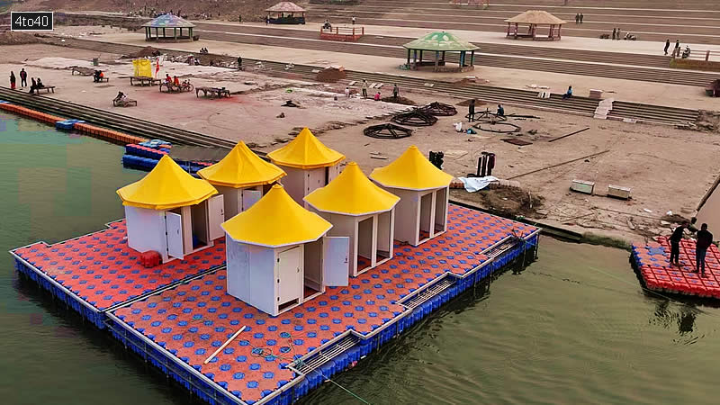 Workers make a floating platform on the Ganges river from interlocking plastic cubes