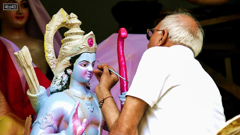 An artist gives a final touch to an idol of Lord Ram ahead of Ram Navami